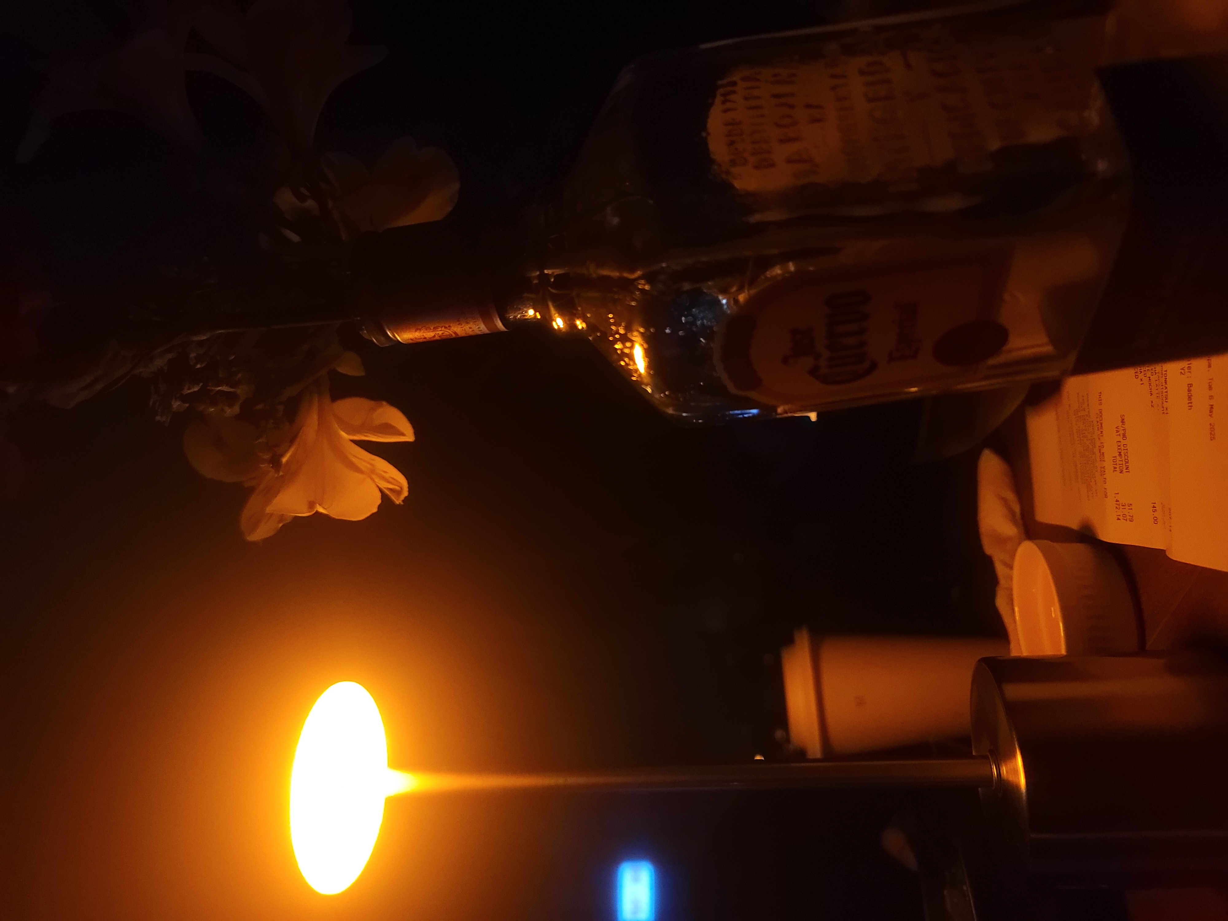 Low-light candid photography scene with warm interior lighting.